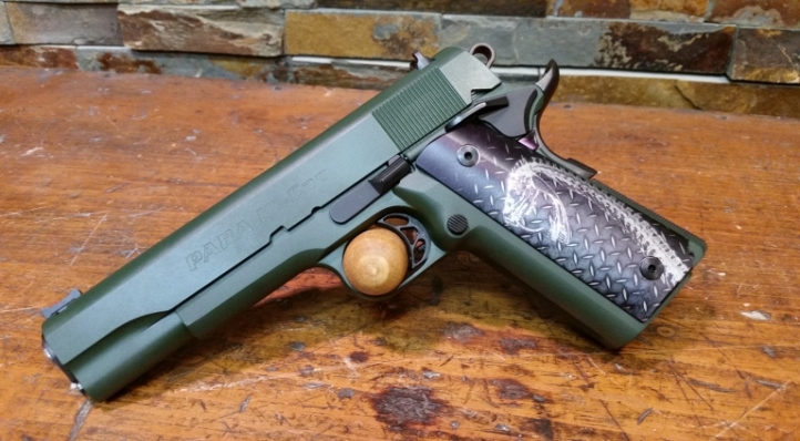 Stainless Para Ordnance 14-45 1911.  Highland Green with custom grips, black Fire Control and accents.  Difficult to make out in this photo, the grips have a green cast that perfectly matches the Highland Green.