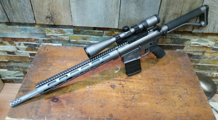 AR308 Aero Precision M5E1 lower with 18 DPMS SASS barrel, Midwest Industries 15 hand guard, Giesselle SSA-E trigger, Ace entry stock, Ergo grip, BCM medium gunfighter charging handle, Shrewd muzzle brake custom fitted to barrel, Midwest Industries QD scope mount Nikon Prostaff 4-12 X 40 mm Mildot scope in Tungsten with black highlights.